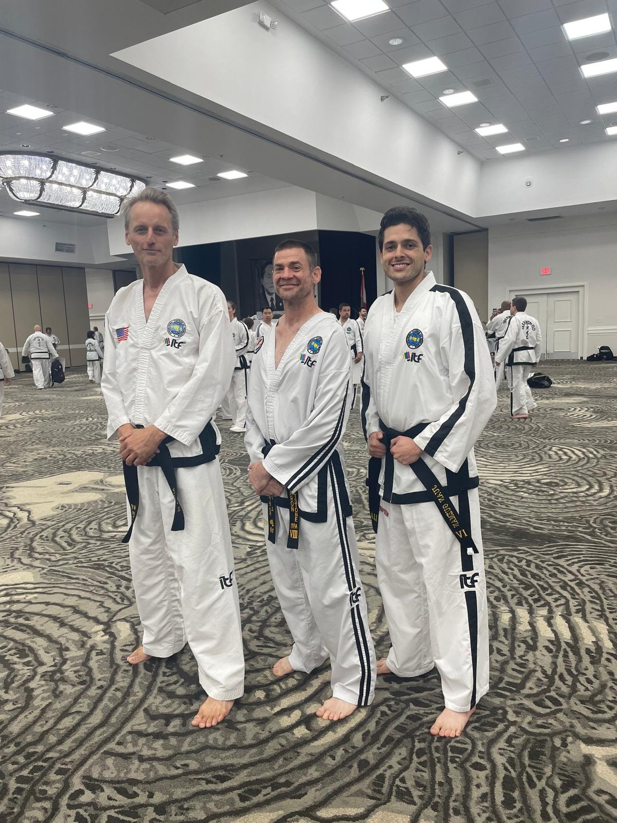 ITF Taekwon-Do black belt practitioners at seminar