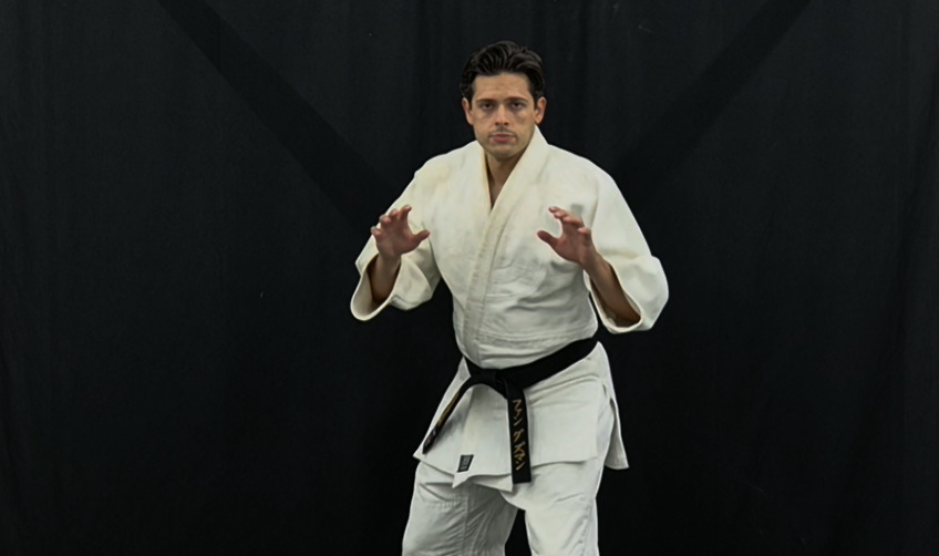Kodokan Judo instructor in gripping ready posture