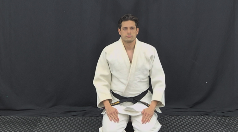Kodokan Judo instructor seated in formal seiza posture