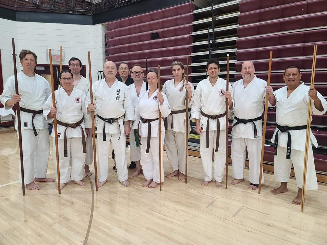 Ryukyu Kobudo Shimbukan group photo with bo staff training