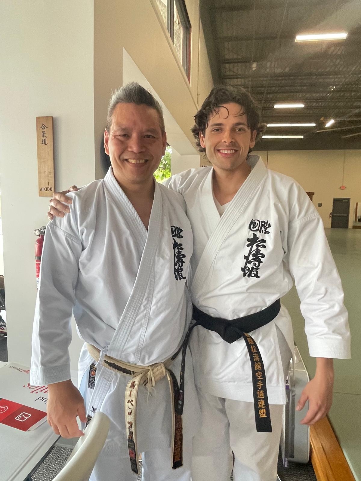 Instructor with SKIF sensei wearing Shotokan karate-gi