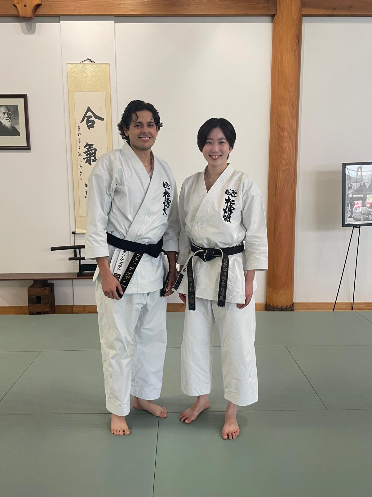 Instructor with SKIF training partner in traditional Shotokan dojo