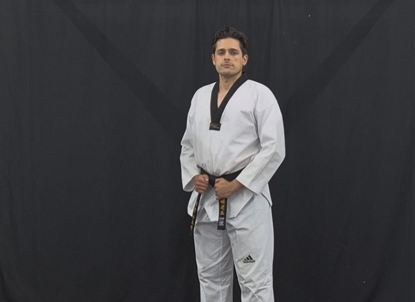 WT Taekwon-Do instructor in white dobok with black belt